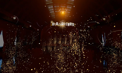 大型モニターにエナジーボールのエフェクトとスコアが映る試合風景。左で生徒がプレー中（HADO体験会）